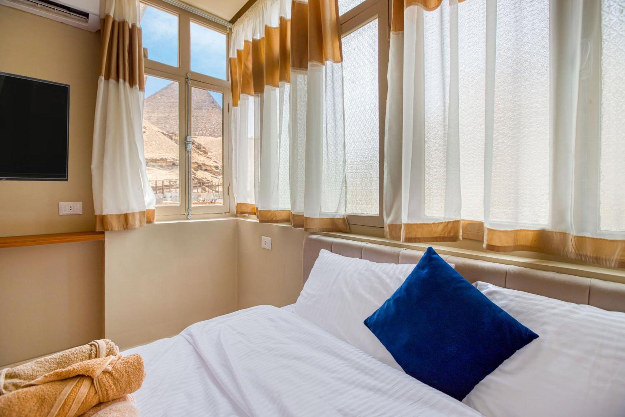 The Grand Pyramids View Hotel Kafret el-Gabal Quarto foto