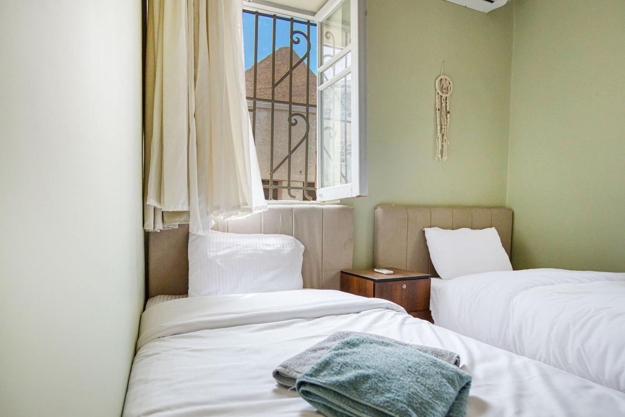 The Grand Pyramids View Hotel Kafret el-Gabal Quarto foto